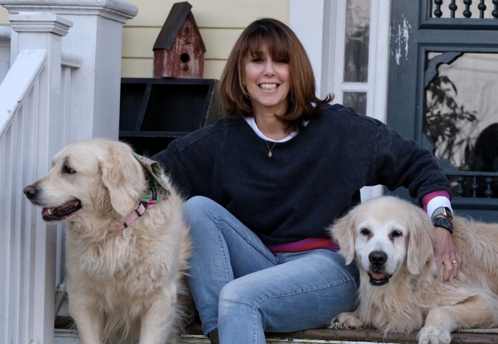 Me (Janice) sitting on my front porch with my two dogs, Joey and Bailey