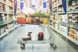 Grocery cart in store aisle