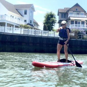 janice rowing on a paddle board