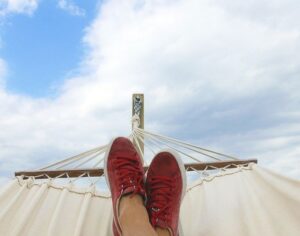 Someone who just retired resting in a hammock