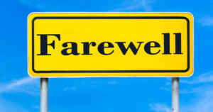 yellow road sign on two metal poles. Wording on sign is "Farewell". Blue sky in the background