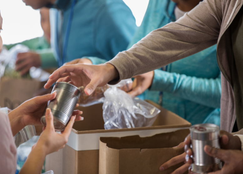 volunteers handing out food at a food bank