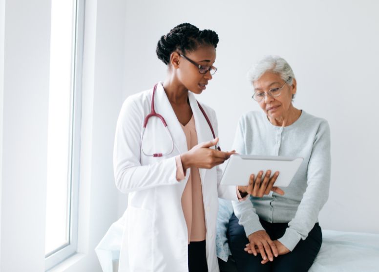 female doctor explaining something to senior female patient