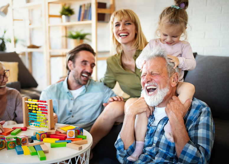 3 generations of family members playing games together