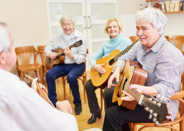 group of seniors taking a guitar lesson