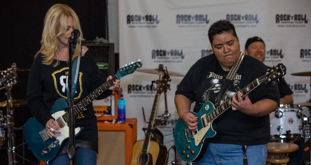 post author Vickie Velasquez playing guitar with Nancy Wilson of the and Heart