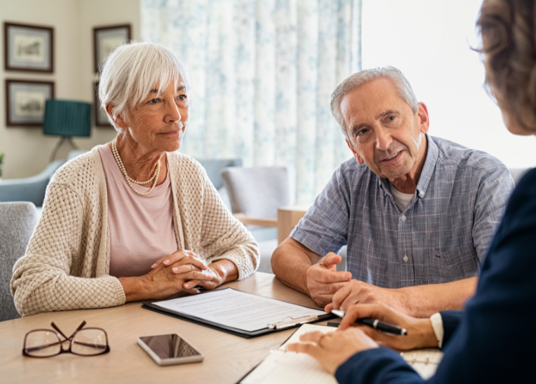 senior couple talking to a financial advisor