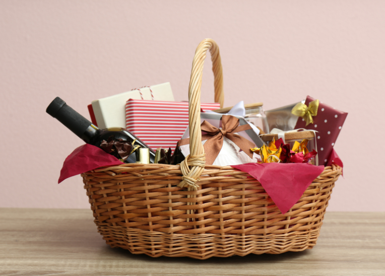 gift basket containing wrapped presents and a bottle of wine