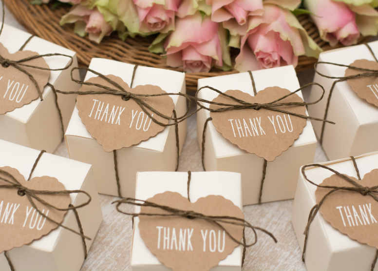 small boxes with heart shaped brown paper tags that say "Thank you"